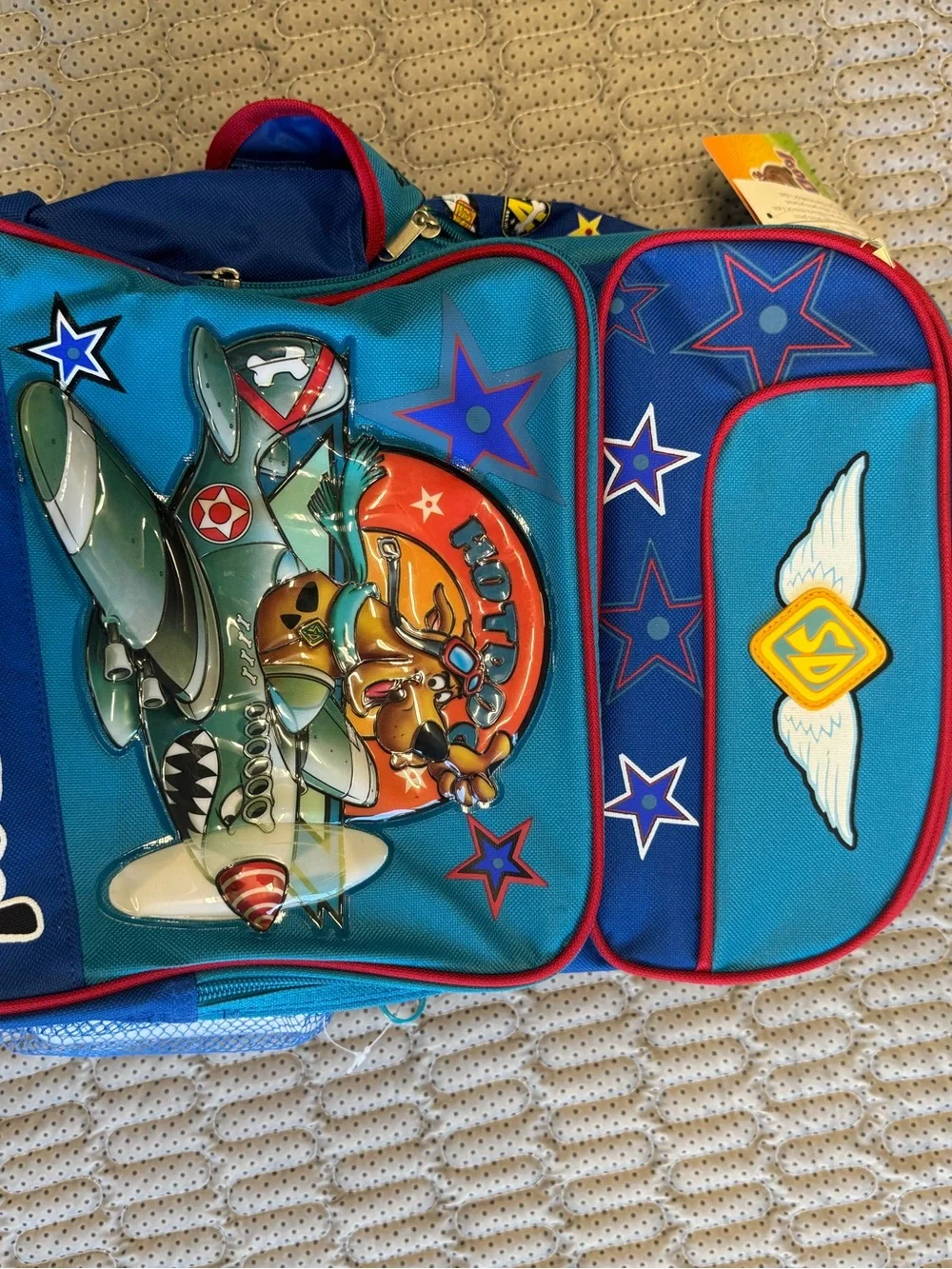 Vintage Scooby-Doo rolling backpack features a pilot graphic of Scooby-Doo